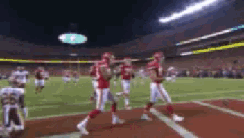 a football game is being played in a stadium