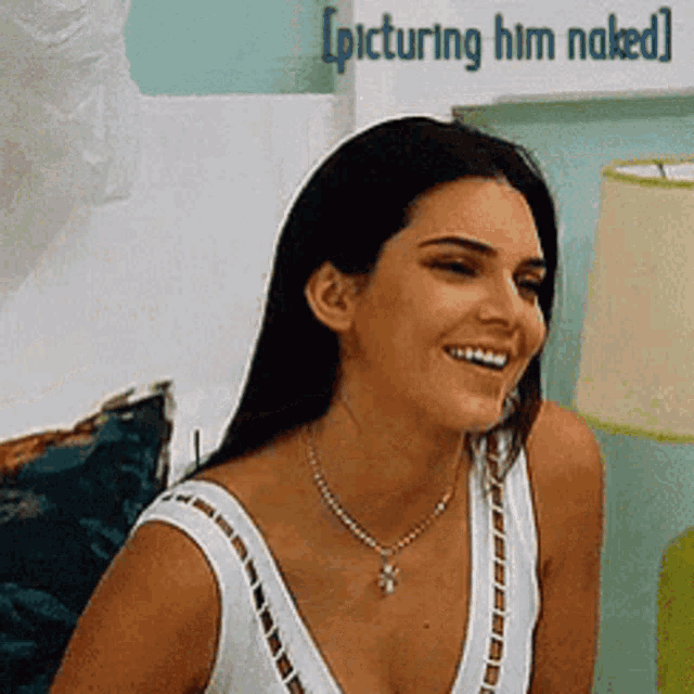 a woman in a white tank top is smiling with the words picturing him naked below her