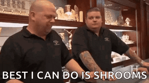 two men are standing next to each other in a store .