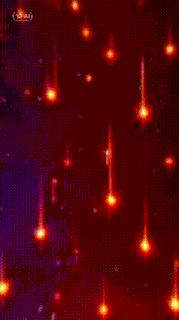 a close up of a woman 's face with red stars falling from her hair