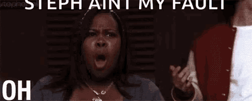 a woman is making a funny face with her mouth open and the words `` steph ain 't my fault oh '' .