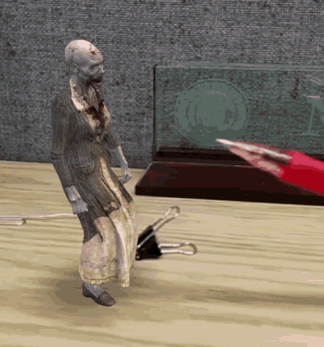 a statue of a zombie standing on a table