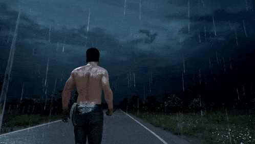 a man walking down a road in the rain