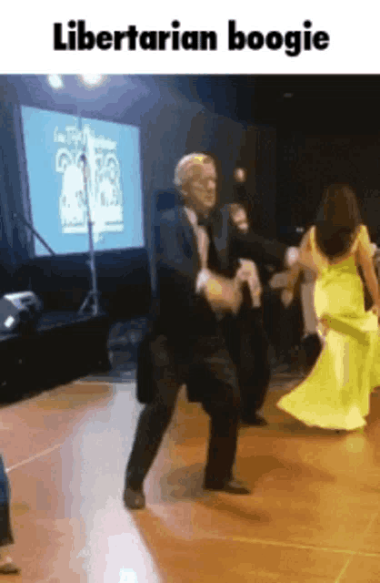 a man in a tuxedo is dancing with a woman in a yellow dress with the words libertarian boogie below him