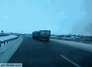a truck is driving down a highway with a gif-finder.com watermark