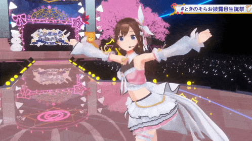 a girl in a pink and white dress is dancing on a stage with a sign that says " hatsune miku "