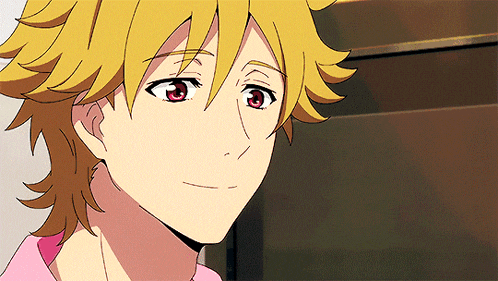 a close up of a person 's face with yellow hair