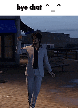 a man in a suit is walking on a pier at night and says `` bye chat '' .