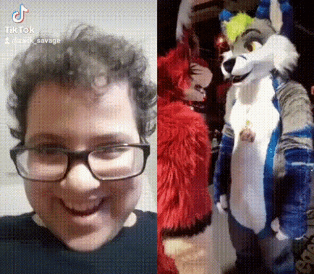 a man wearing glasses and a furry costume is smiling next to a furry costume .