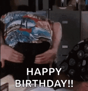 a man is hugging a woman and saying `` happy birthday '' .