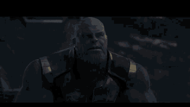 thanos from the movie avengers infinity war looks up at the sky