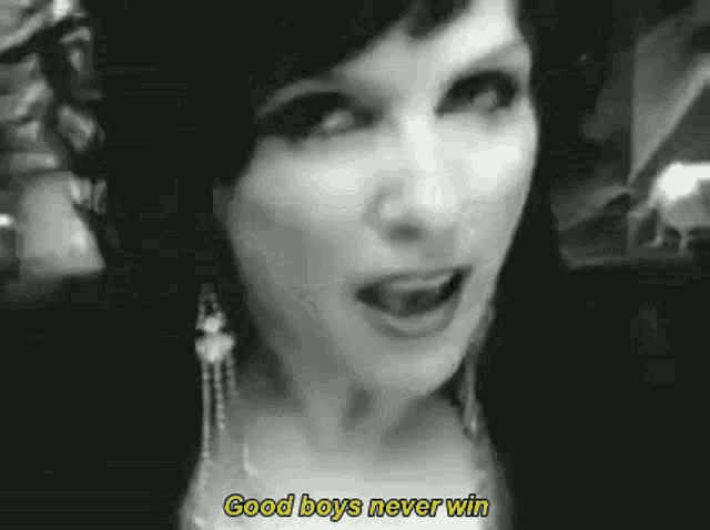 a woman is talking in a black and white photo with the words `` good boys never win '' .