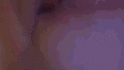 a close up of a person 's mouth with their tongue out