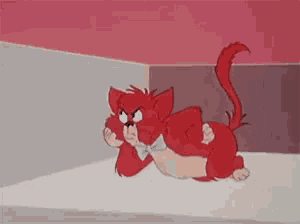 a red cartoon cat is laying on its back in a corner of a room .