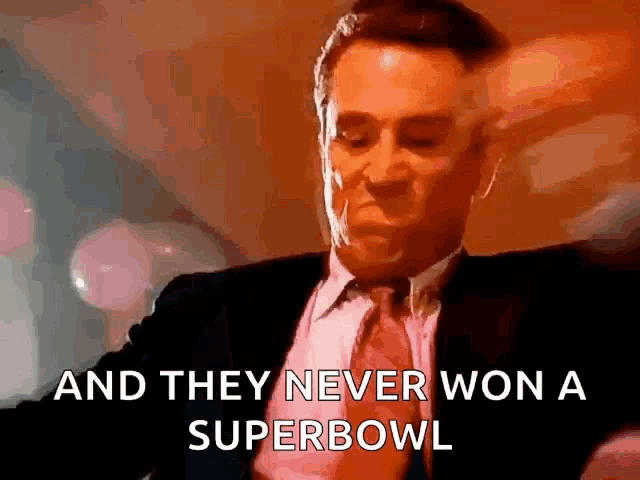a man in a suit and tie is saying that they never won a super bowl