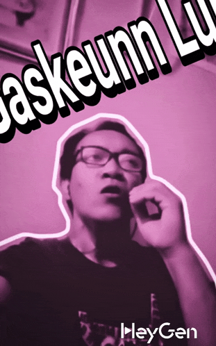 a man wearing glasses is talking on a cell phone with the words " askeunn lu " behind him