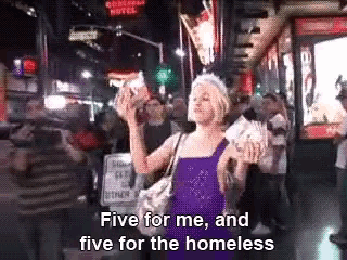 a woman in a purple dress says five for me and five for the homeless in a crowded street .
