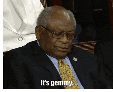 a man in a suit and tie with the words it 's gemmy