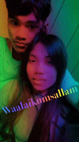 a man and a woman are posing for a picture and the words waalaikumsalam are on the bottom