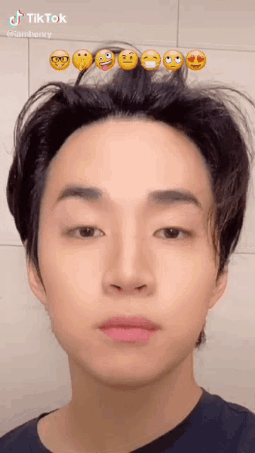 a young man with a bunch of emojis in his hair