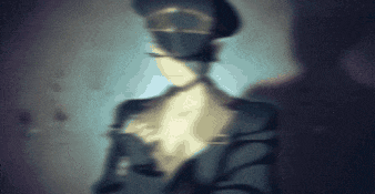 a blurred image of a man in a hat