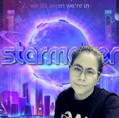 a woman wearing glasses stands in front of a starmaker logo
