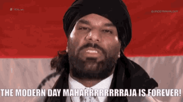 a man with a beard is standing in front of a red white and blue flag and says the modern day mahar