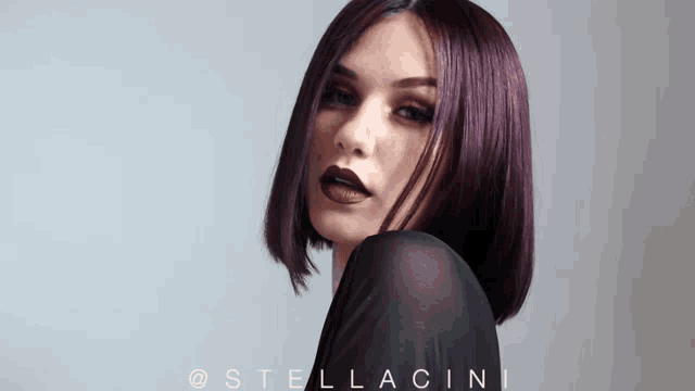 a close up of a woman 's face with stellacini written on the bottom right