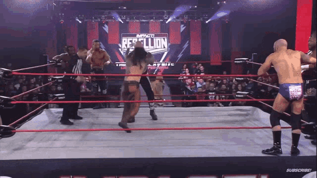 a wrestling ring with a sign that says " rebellion " on it