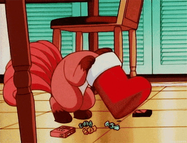 a cartoon character is putting candy in a christmas stocking under a table