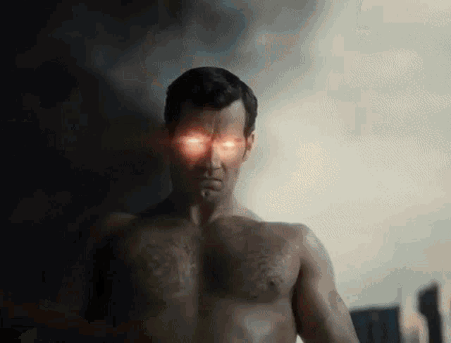 a shirtless man with red eyes is standing in front of a cloudy sky .