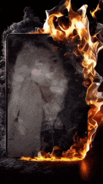 a picture of a woman surrounded by flames and smoke