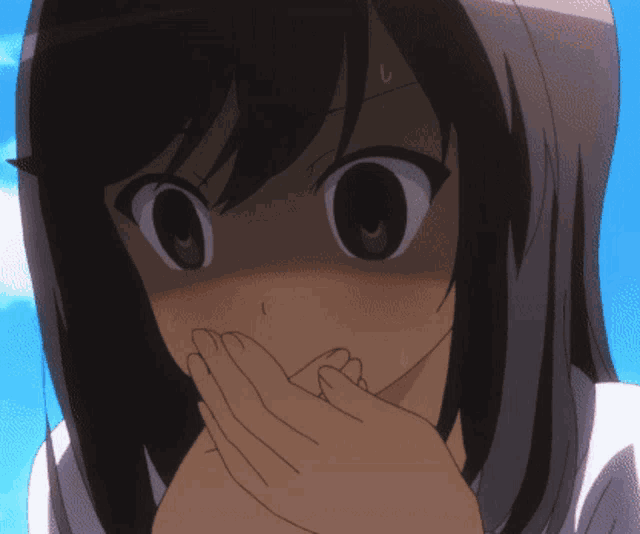 a close up of a girl with her hand on her face