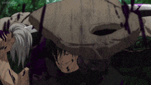 a man is holding a large rock on his head
