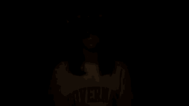 a girl wearing a white t-shirt that says coverna on it