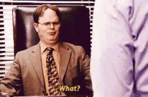 a man in a suit and tie is asking a question