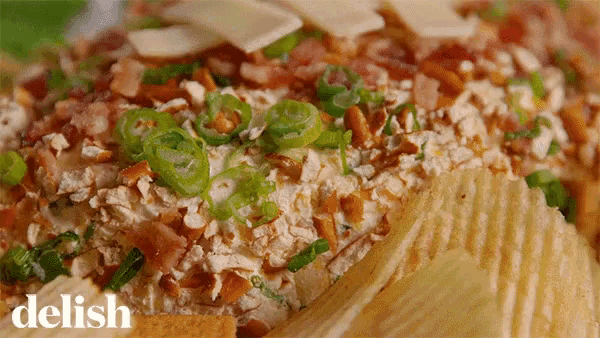 a close up of a food item with the word delish in the corner