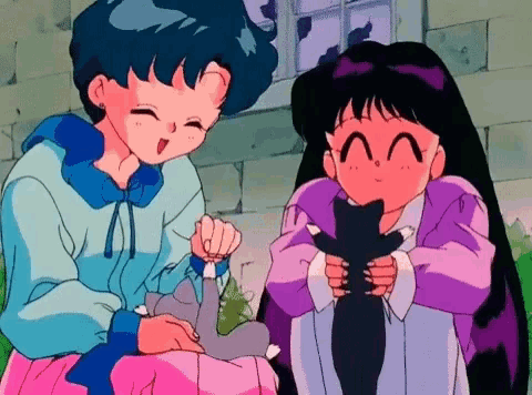 two anime girls are holding a black cat in their arms