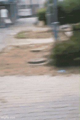 a blurry picture of a person walking down a sidewalk with the words imgflip.com at the bottom