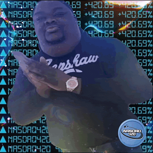 a man wearing a shirt that says nasdaq 420 on it
