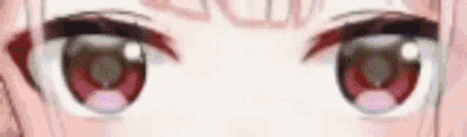 a close up of a girl 's eyes with red circles and a white background .