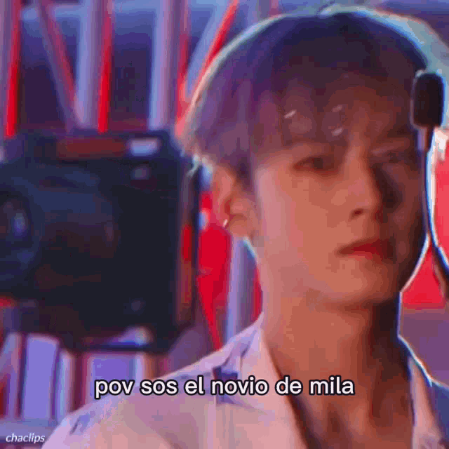 a close up of a man 's face with the words pov sos el novio de mia written on it .