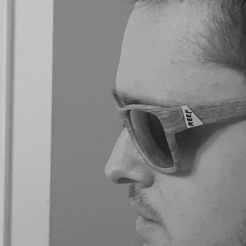 a man wearing a pair of reef sunglasses on his face