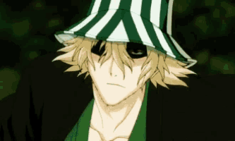 a man wearing a green and white striped hat with black eyes