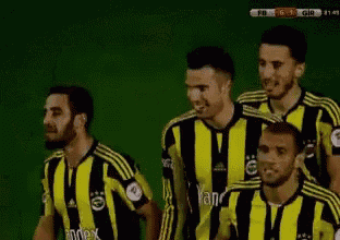 a group of soccer players wearing yellow and black striped jerseys with the word index on them