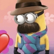 a minion with a hat , scarf and overalls is standing next to a red heart .