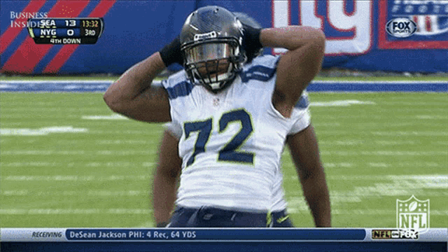 a football player with the number 72 on their jersey