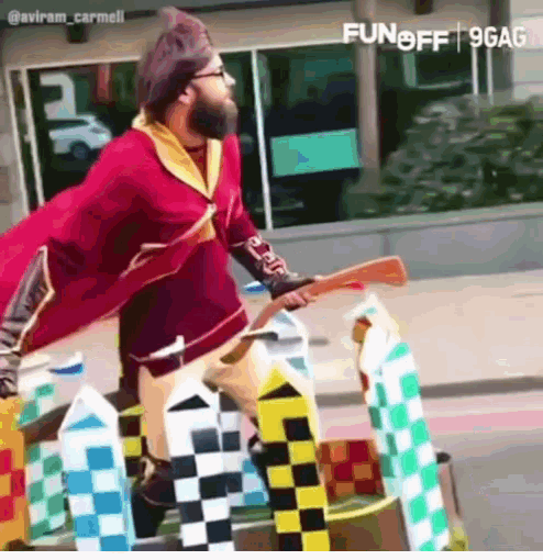 a man in a harry potter costume is riding a broomstick