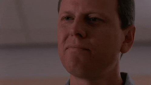 a close up of a man 's face with the words " no " above him