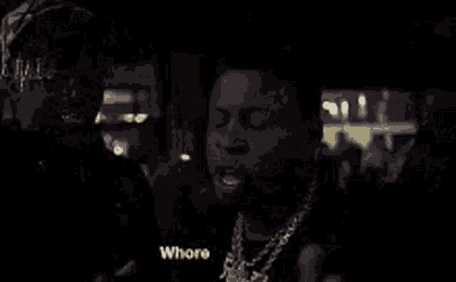 two men are standing next to each other in a dark room with the words lil bitch on the bottom